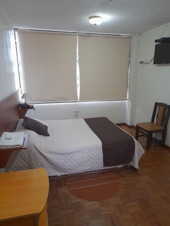 Postel nebo postele na pokoji v ubytování Hotel Bacastell