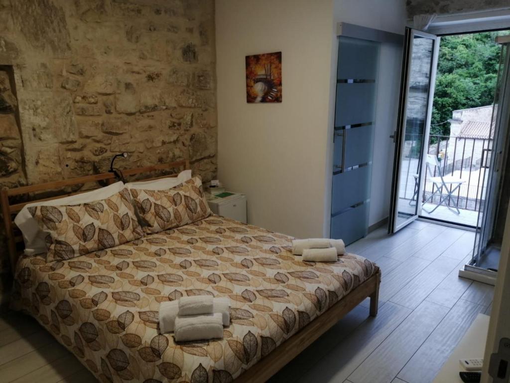 Postel nebo postele na pokoji v ubytování Il Daviduccio ibla