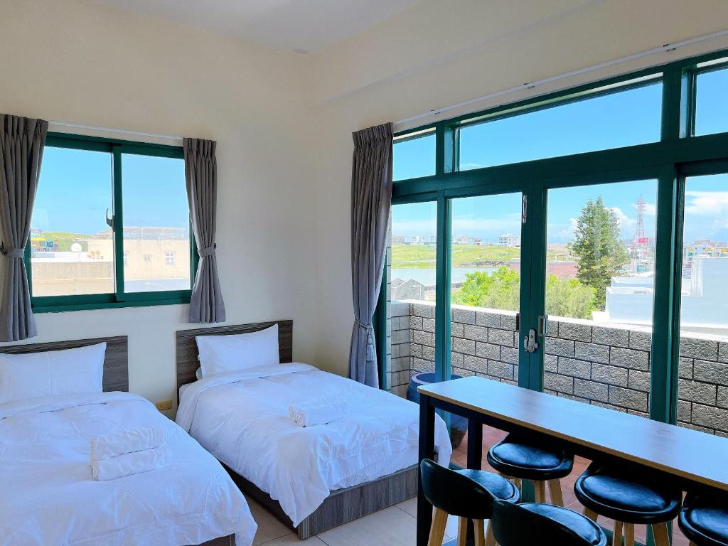 Postel nebo postele na pokoji v ubytování Azumaya guest house