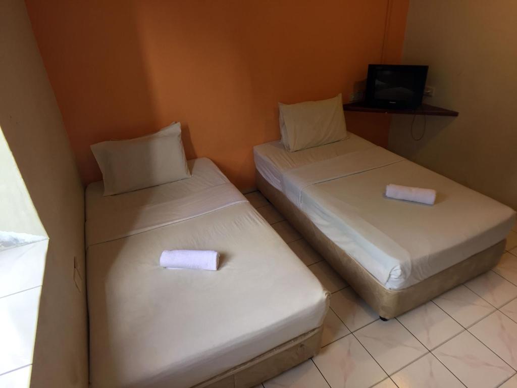 Postel nebo postele na pokoji v ubytování Abell Residence