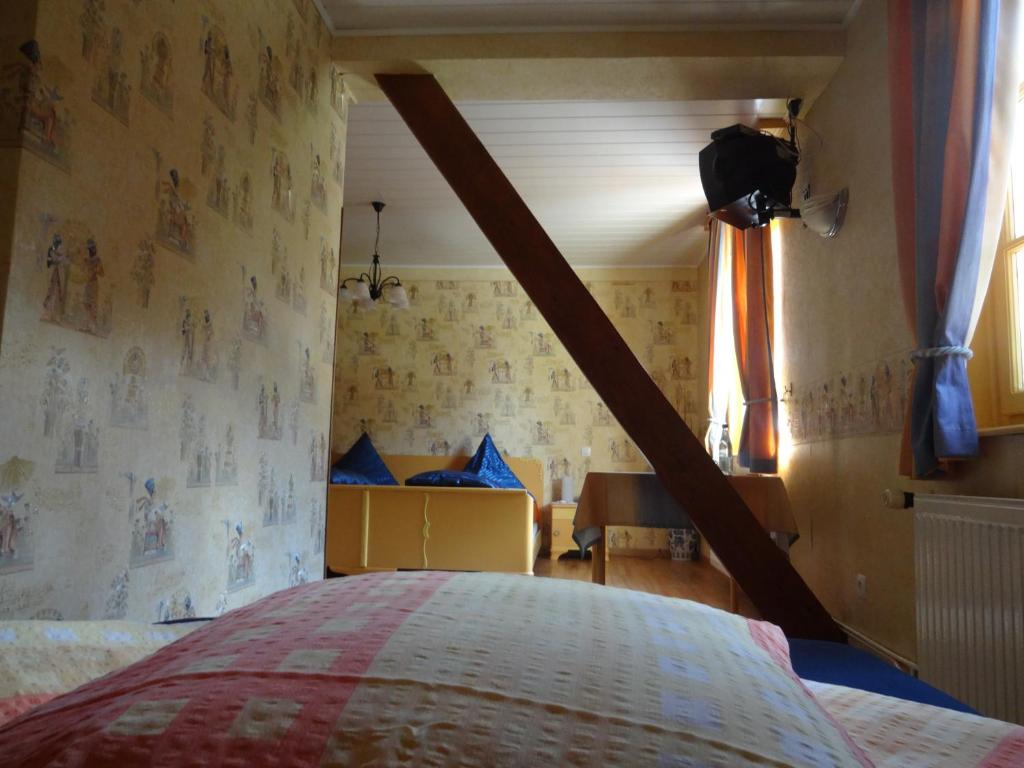 Postel nebo postele na pokoji v ubytování Hotel-Restaurant du Windstein
