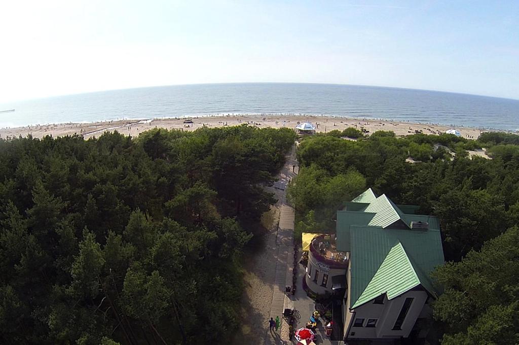 an overhead view of a beach with a building and the ocean at Vila Krantas in Palanga