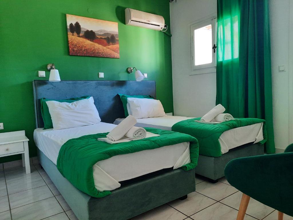 A bed or beds in a room at Athina Apartments