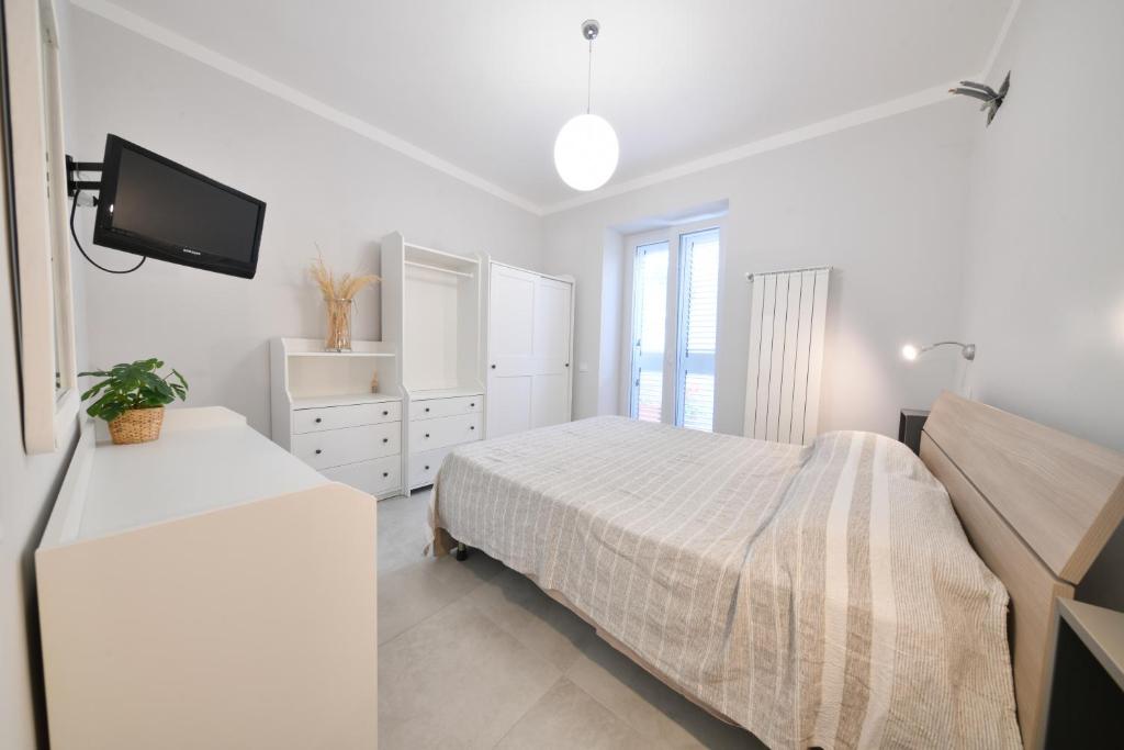 Łóżko lub łóżka w pokoju w obiekcie CASA ARIANNA