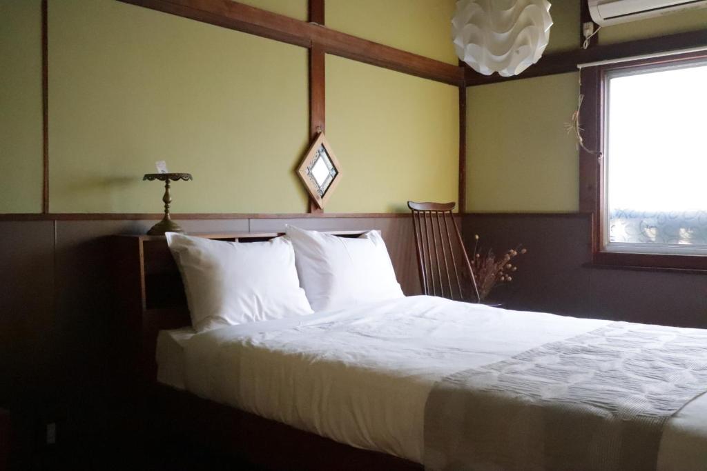 Voodi või voodid majutusasutuse Mojiko Guesthouse PORTO toas
