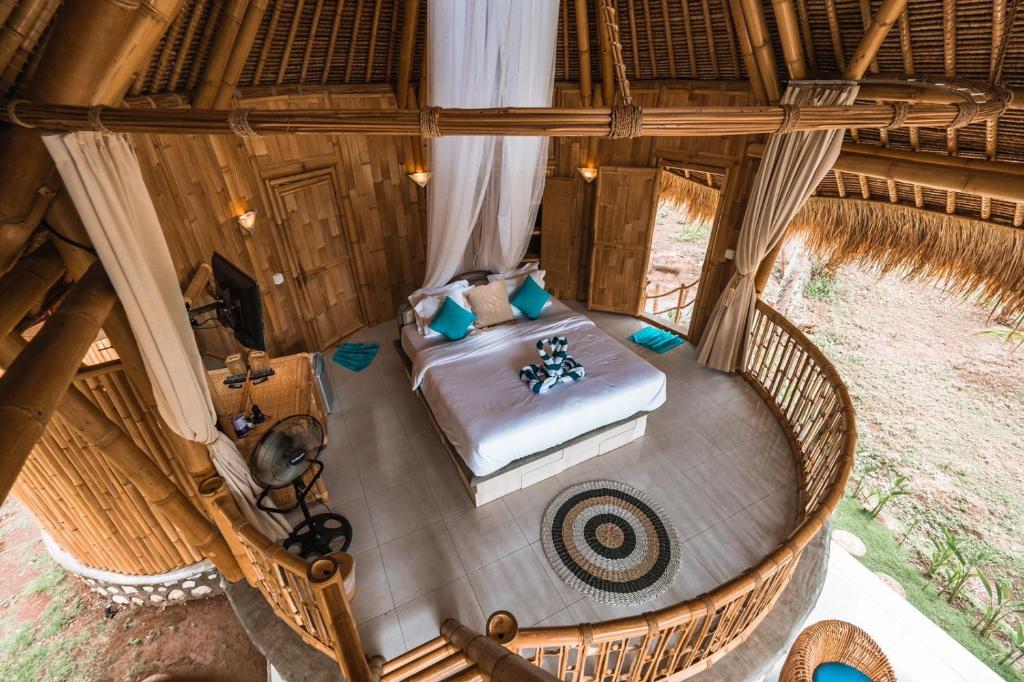 an overhead view of a bedroom in a tree house at La royale Romantic Bamboo Villas in Klungkung