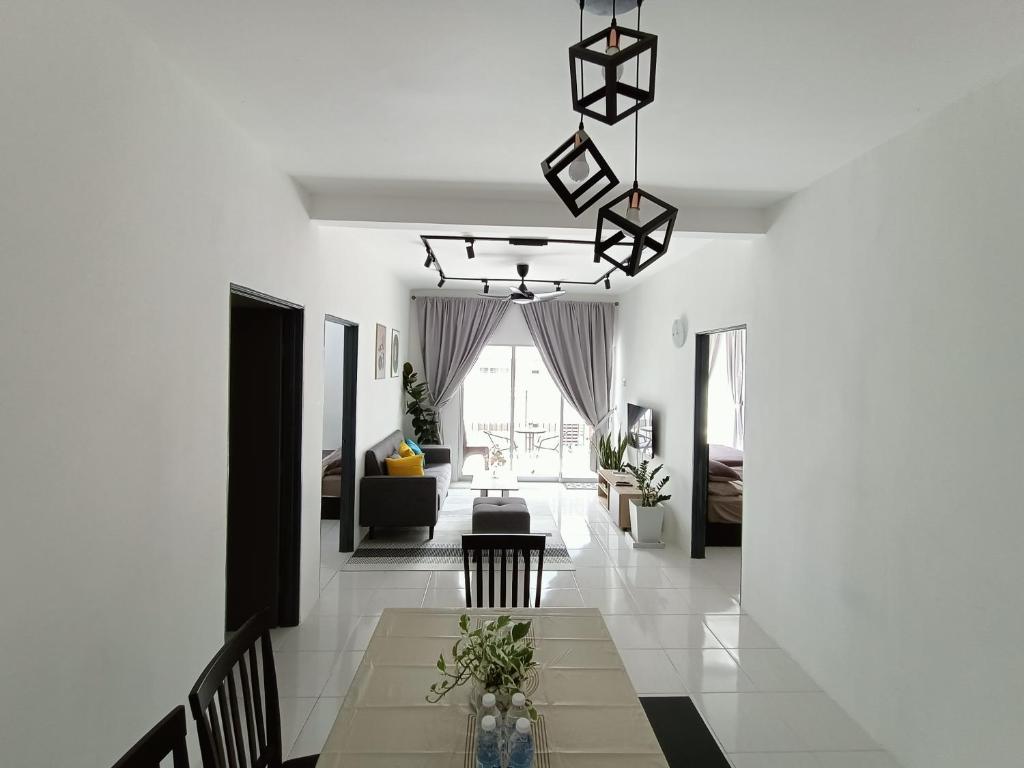 a living room with white walls and a dining room at Dream 3 @ Emerald avenue in Brinchang