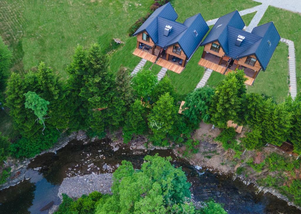 an overhead view of a house with blue roofs at Novosiele Residence in Bystre