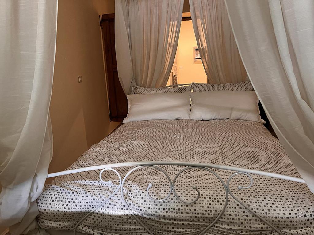 Katil atau katil-katil dalam bilik di Sylvie nelle Pietre silenti antica dimora del 1300
