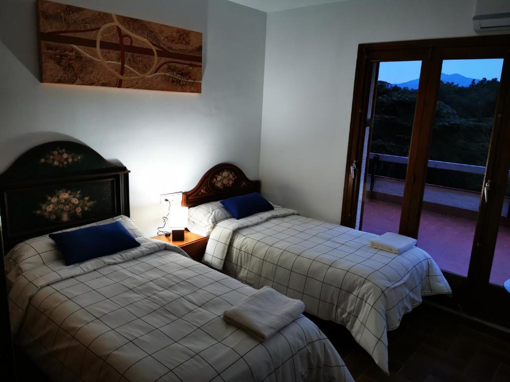 Postel nebo postele na pokoji v ubytování Villa Can Raurell - Girona Costa Brava
