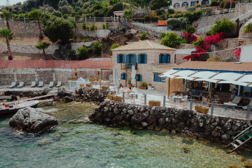 an aerial view of a house and the water at Sea Mansion Lefkada in Nikiana