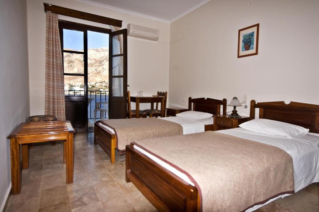 Postel nebo postele na pokoji v ubytování Hotel Porto Potha