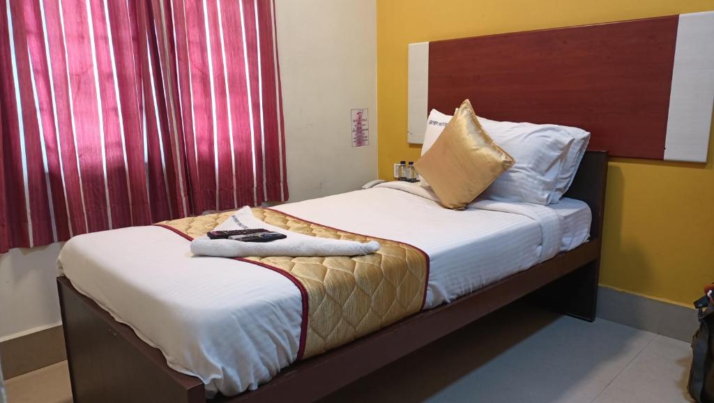 Postel nebo postele na pokoji v ubytování Skyry Hotels Adyar