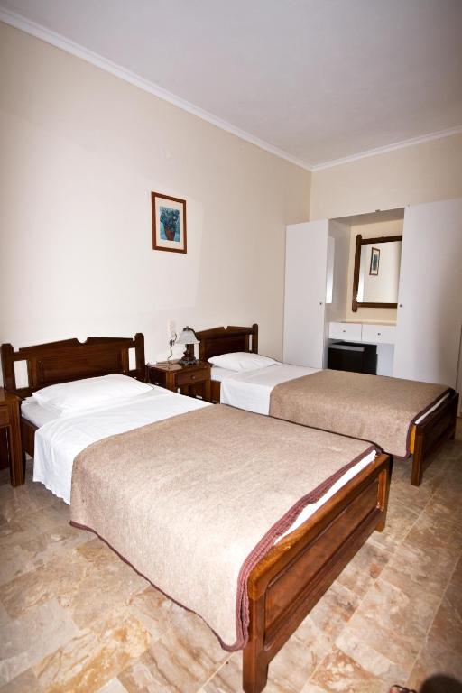 Postel nebo postele na pokoji v ubytování Hotel Porto Potha