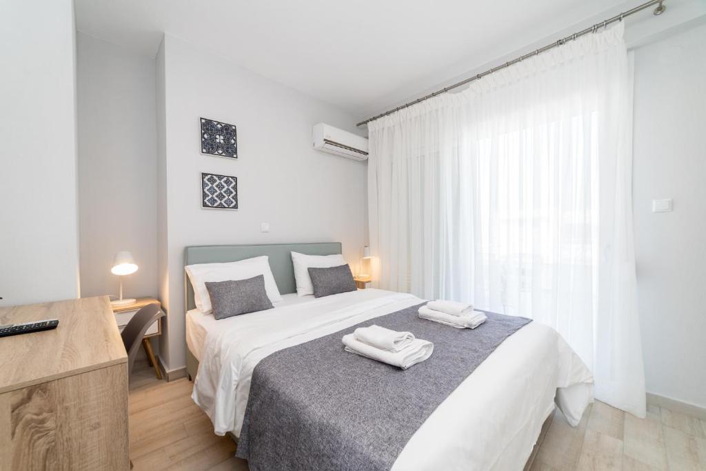 Postel nebo postele na pokoji v ubytování Thalassa & Thalassa Prive Residential Complex