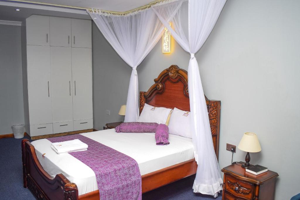 Postel nebo postele na pokoji v ubytování Sheratton Beach Villagio