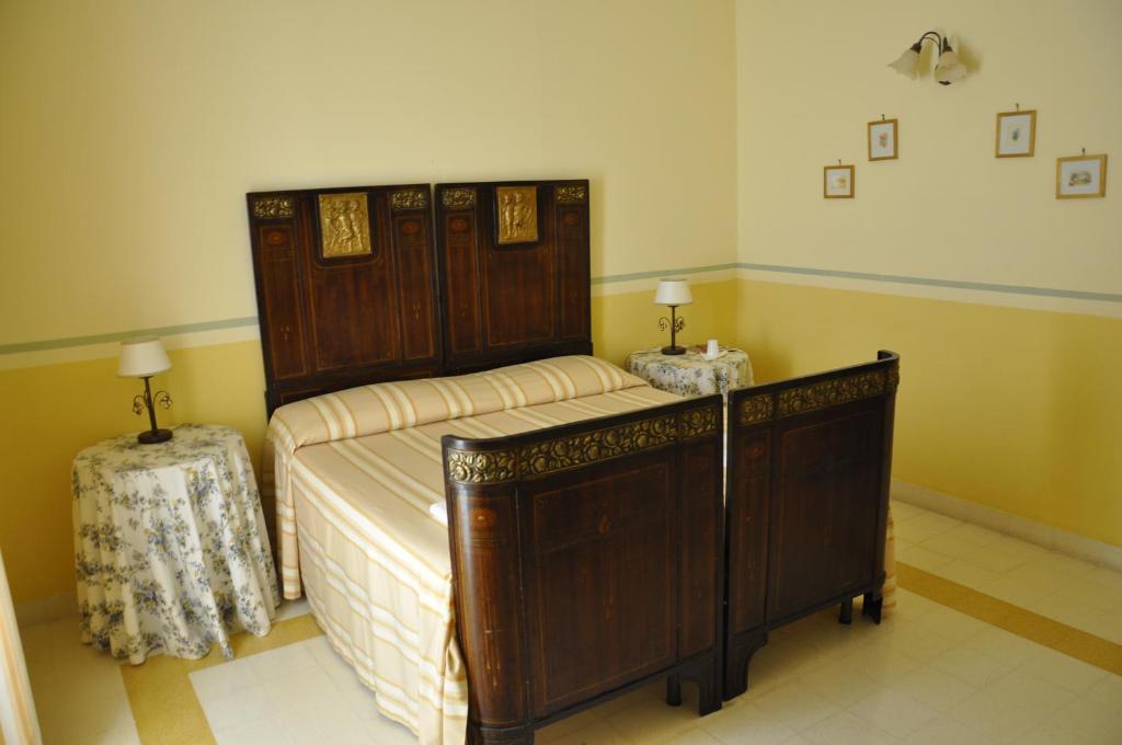 A bed or beds in a room at Hotel Casa Mia