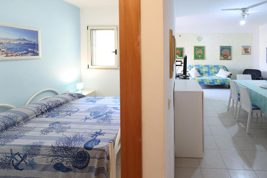 Postel nebo postele na pokoji v ubytování VILLETTA A SCHIERA UNO vicino MALDIVE DEL SALENTO