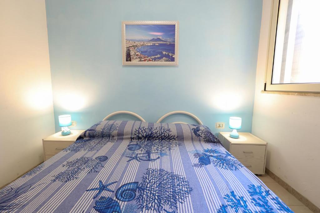 Postel nebo postele na pokoji v ubytování VILLETTA A SCHIERA UNO vicino MALDIVE DEL SALENTO