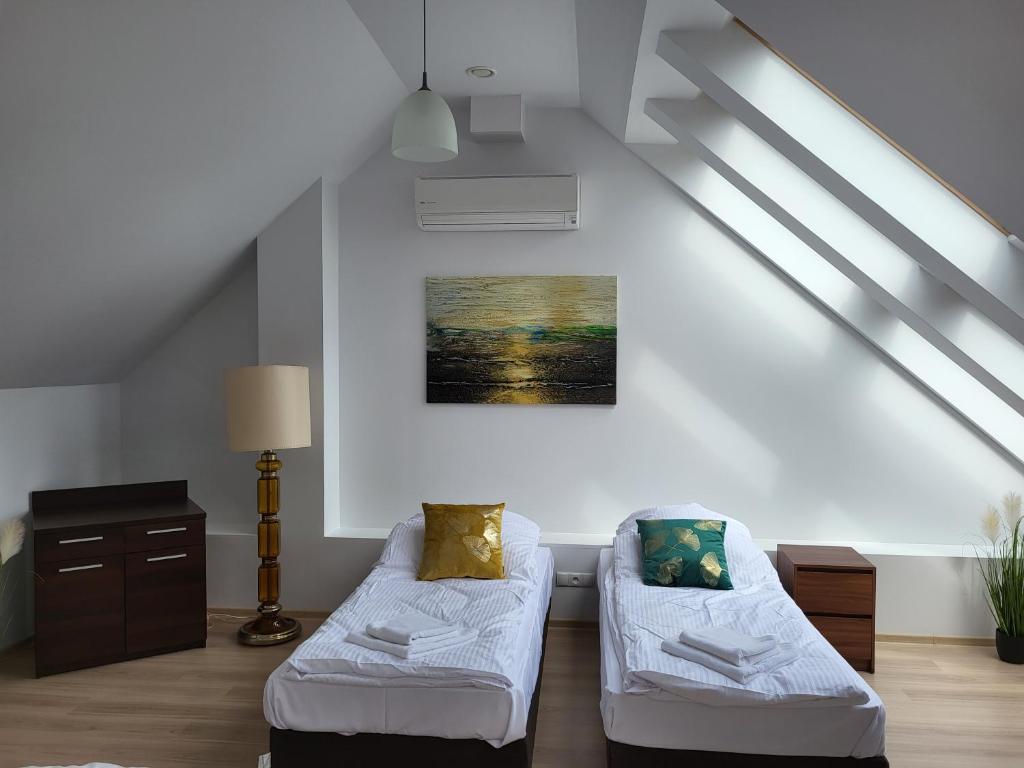Posteľ alebo postele v izbe v ubytovaní Apartament Perła A31