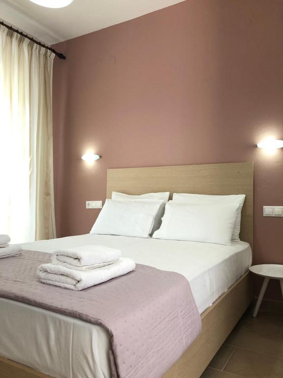 Postelja oz. postelje v sobi nastanitve Tasos Rooms