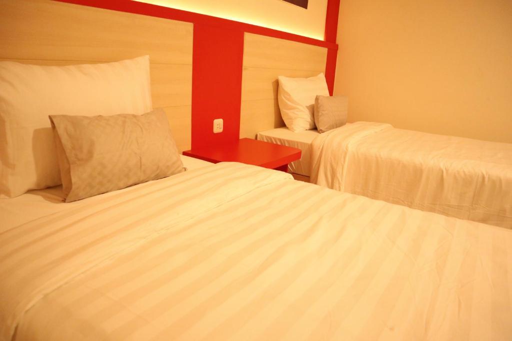 Postel nebo postele na pokoji v ubytování D'Carol Hotel