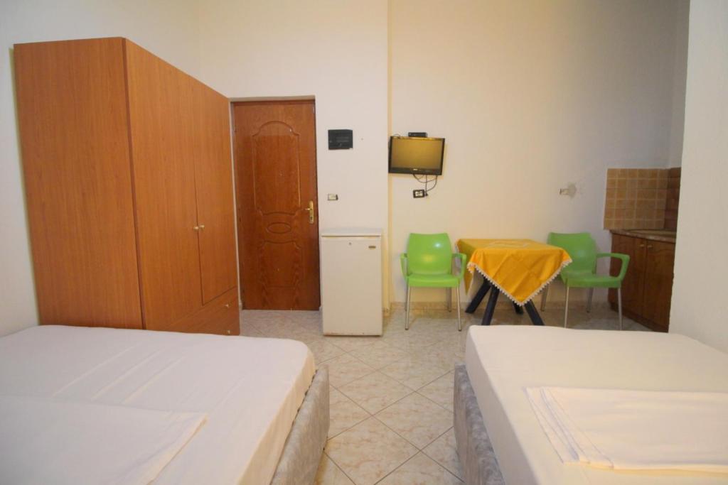 Postel nebo postele na pokoji v ubytování Hotel Vila Vilson