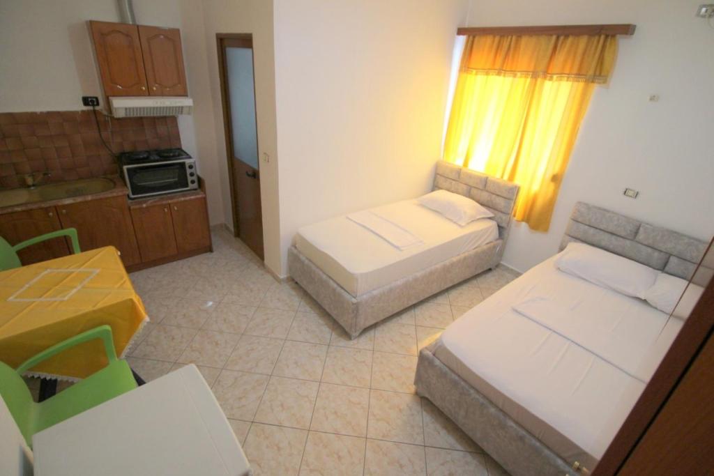 Postel nebo postele na pokoji v ubytování Hotel Vila Vilson