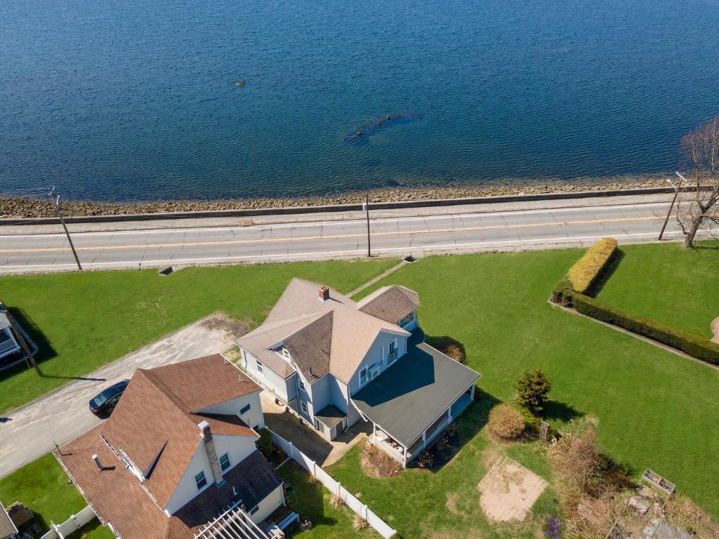 an aerial view of a house next to the water at Spacious Coastal Tiverton Waterfront Getaway cottage in Tiverton