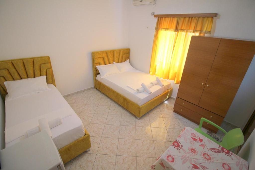 Postel nebo postele na pokoji v ubytování Hotel Vila Vilson