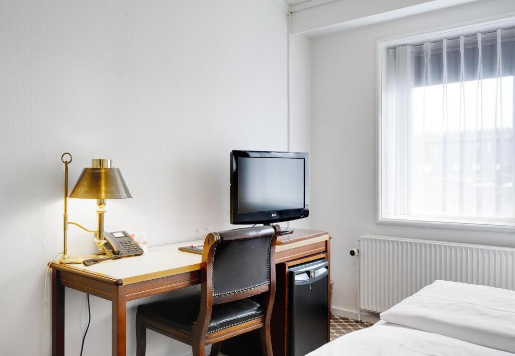 TV a/nebo společenská místnost v ubytování Hotel Kryb I Ly Kro