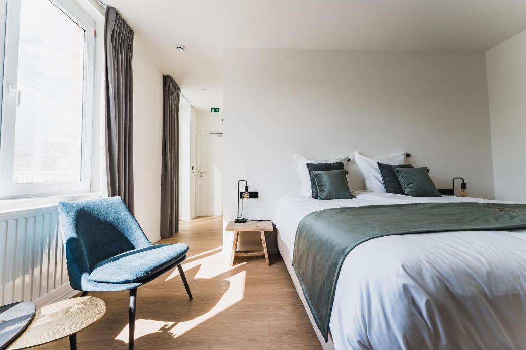 Postel nebo postele na pokoji v ubytování Guesthouse de la Paix