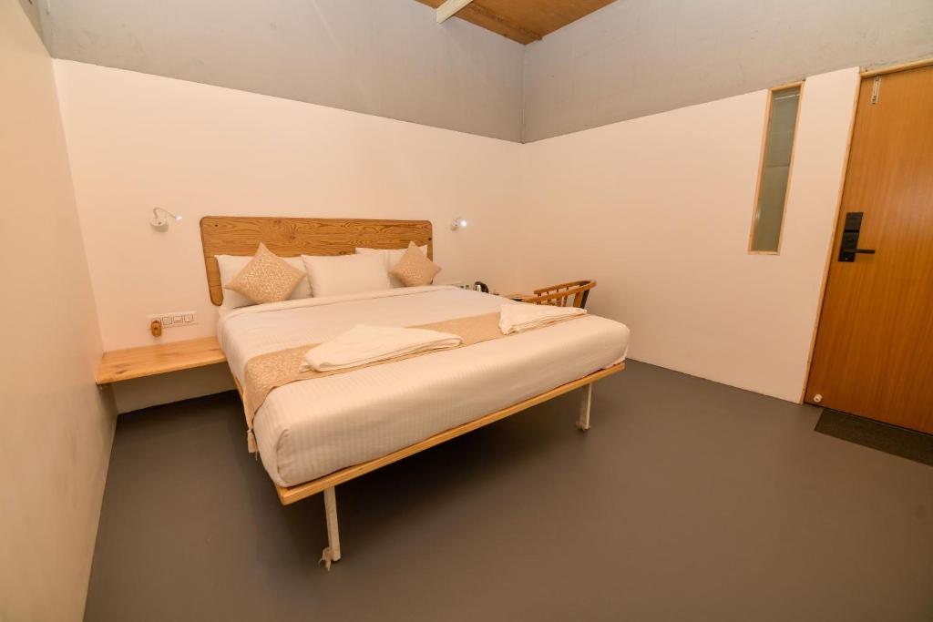 Postel nebo postele na pokoji v ubytování Shine Residency