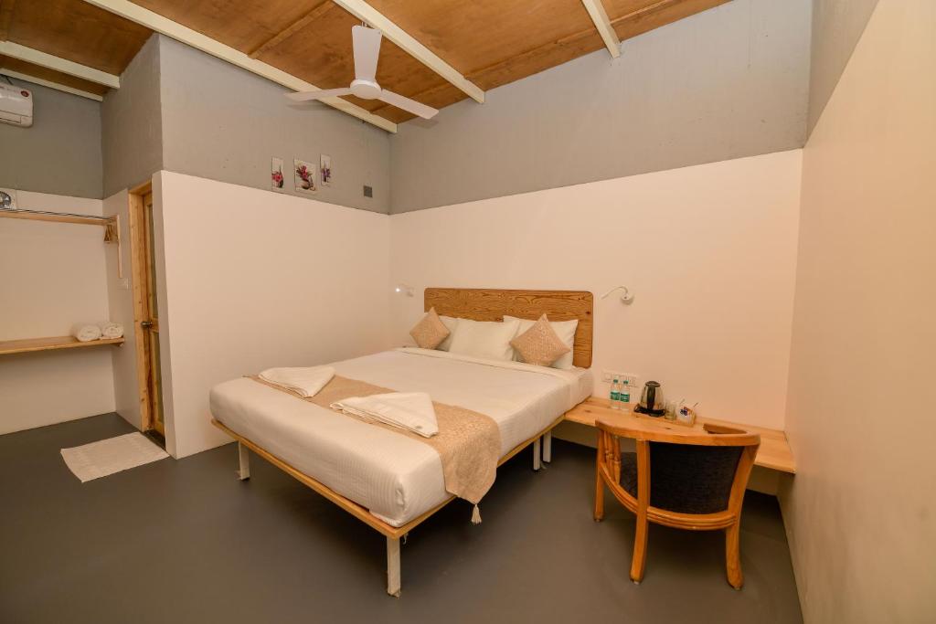 Postel nebo postele na pokoji v ubytování Shine Residency