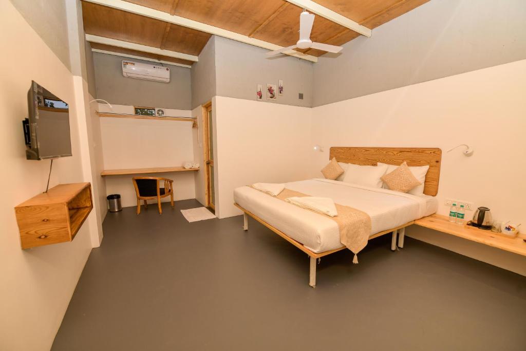 Postel nebo postele na pokoji v ubytování Shine Residency