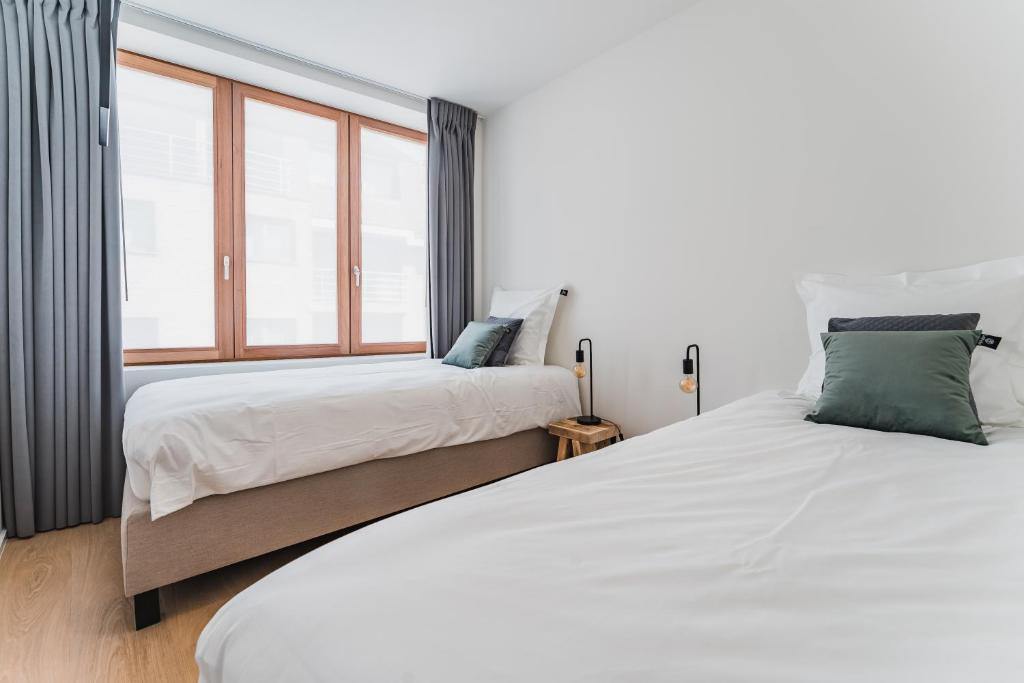 Postel nebo postele na pokoji v ubytování Guesthouse de la Paix
