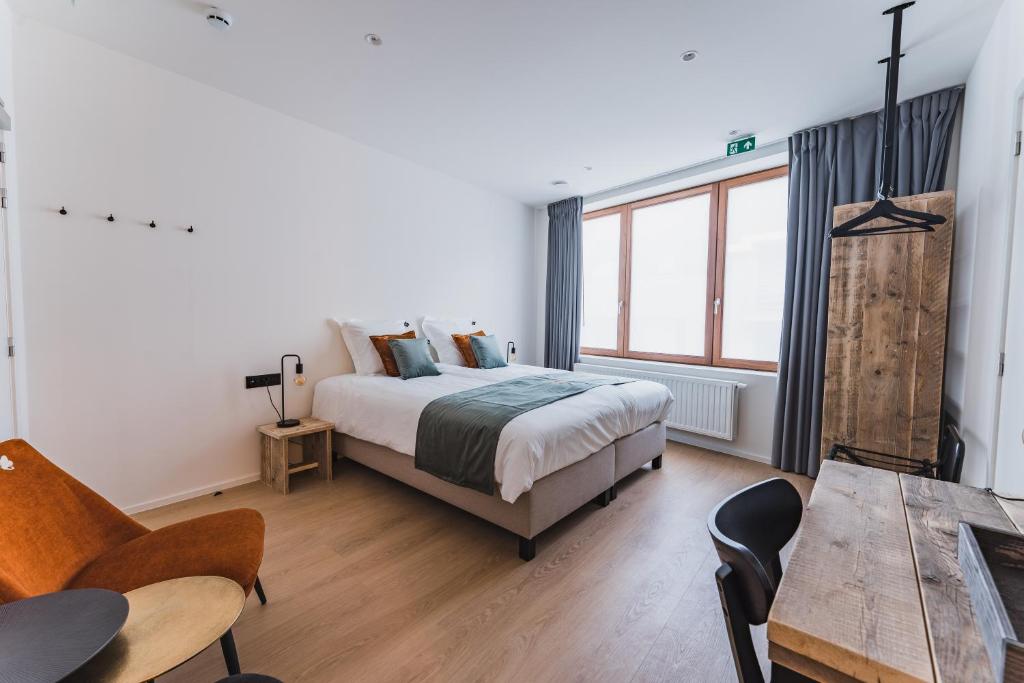 Postel nebo postele na pokoji v ubytování Guesthouse de la Paix