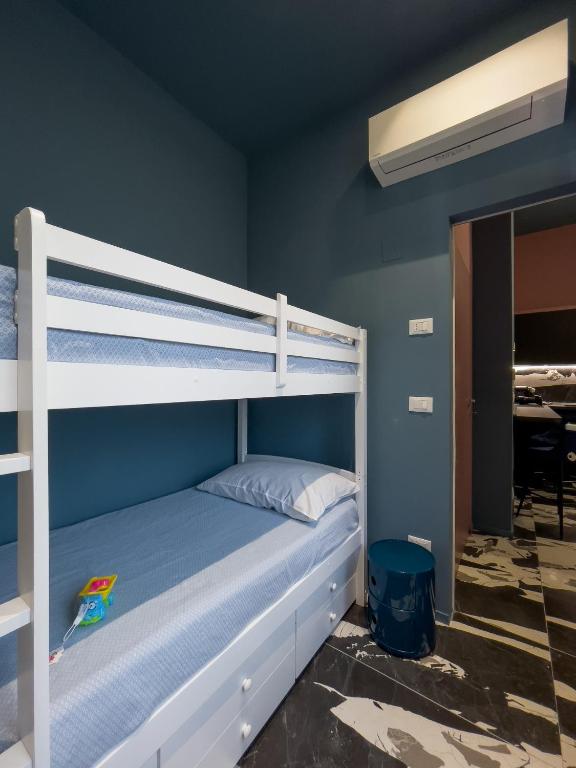 Postel nebo postele na pokoji v ubytování Pescara Blu B&B