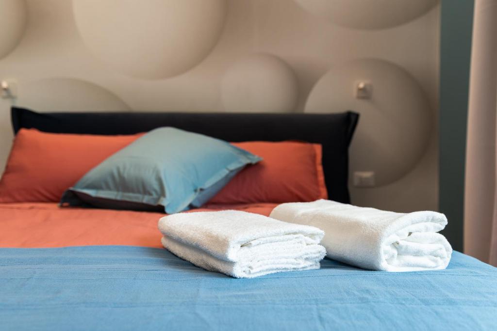 Postel nebo postele na pokoji v ubytování Pescara Blu B&B