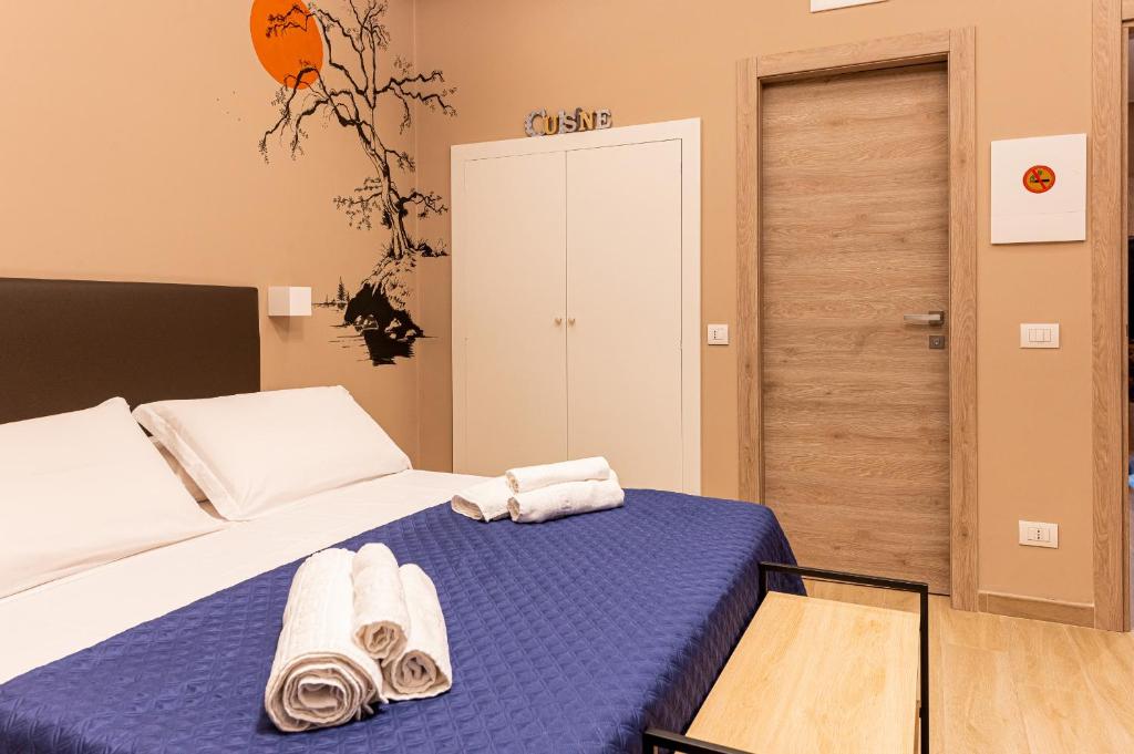 Posteľ alebo postele v izbe v ubytovaní ASTARE -short lets in bari carrassi-