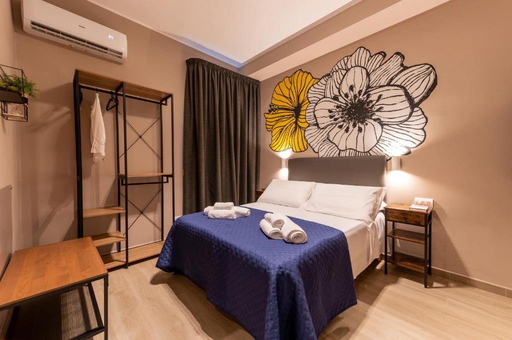 Posteľ alebo postele v izbe v ubytovaní ASTARE -short lets in bari carrassi-