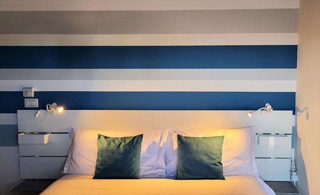 Кровать или кровати в номере Appartamento Garda Star
