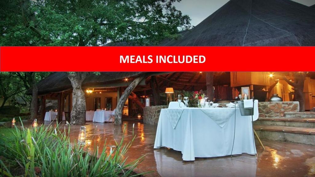 a sign that reads meals updated in front of a tent at Itaga Luxury Private Game Lodge in Bela-Bela