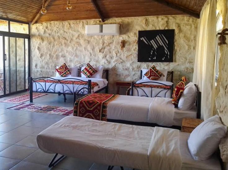 Postel nebo postele na pokoji v ubytování Infinity Lodge