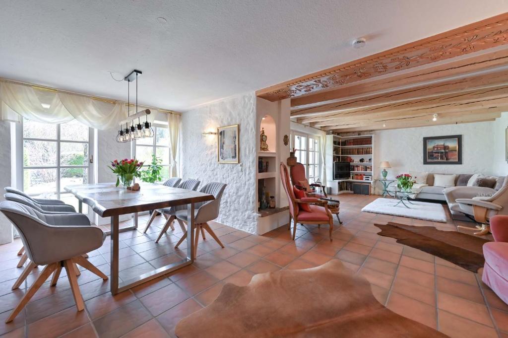 a living room with a table and chairs at Haus Bella in Schwangau