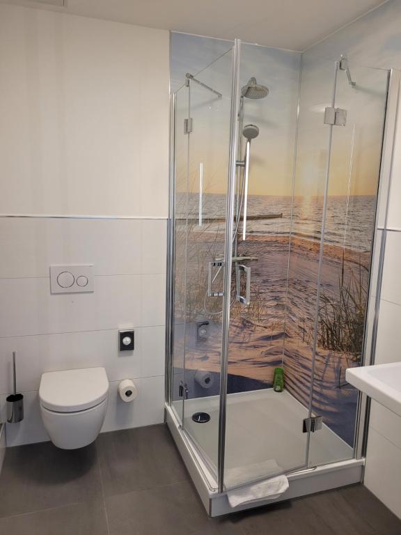 a bathroom with a shower and a toilet at Pension zum Kleistpark in Frankfurt Oder