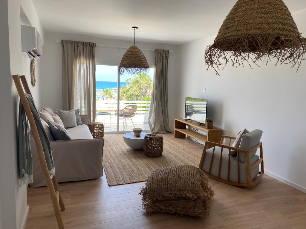 a living room with a view of the ocean at KSQUARED in Protaras