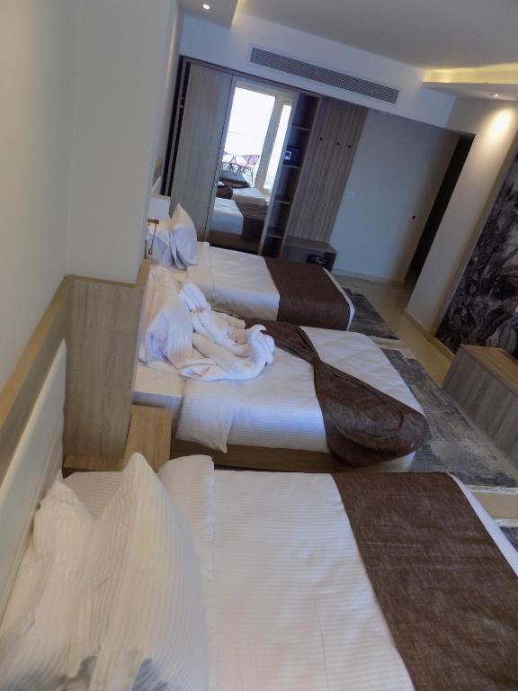 Postel nebo postele na pokoji v ubytování Jewel Sharm El Sheikh Hotel