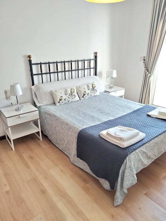 Postel nebo postele na pokoji v ubytování APARTAMENTO VILLA 3