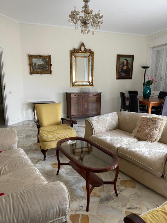 a living room with couches and a coffee table at Lovely apartment in the heart of Tangier in Tangier